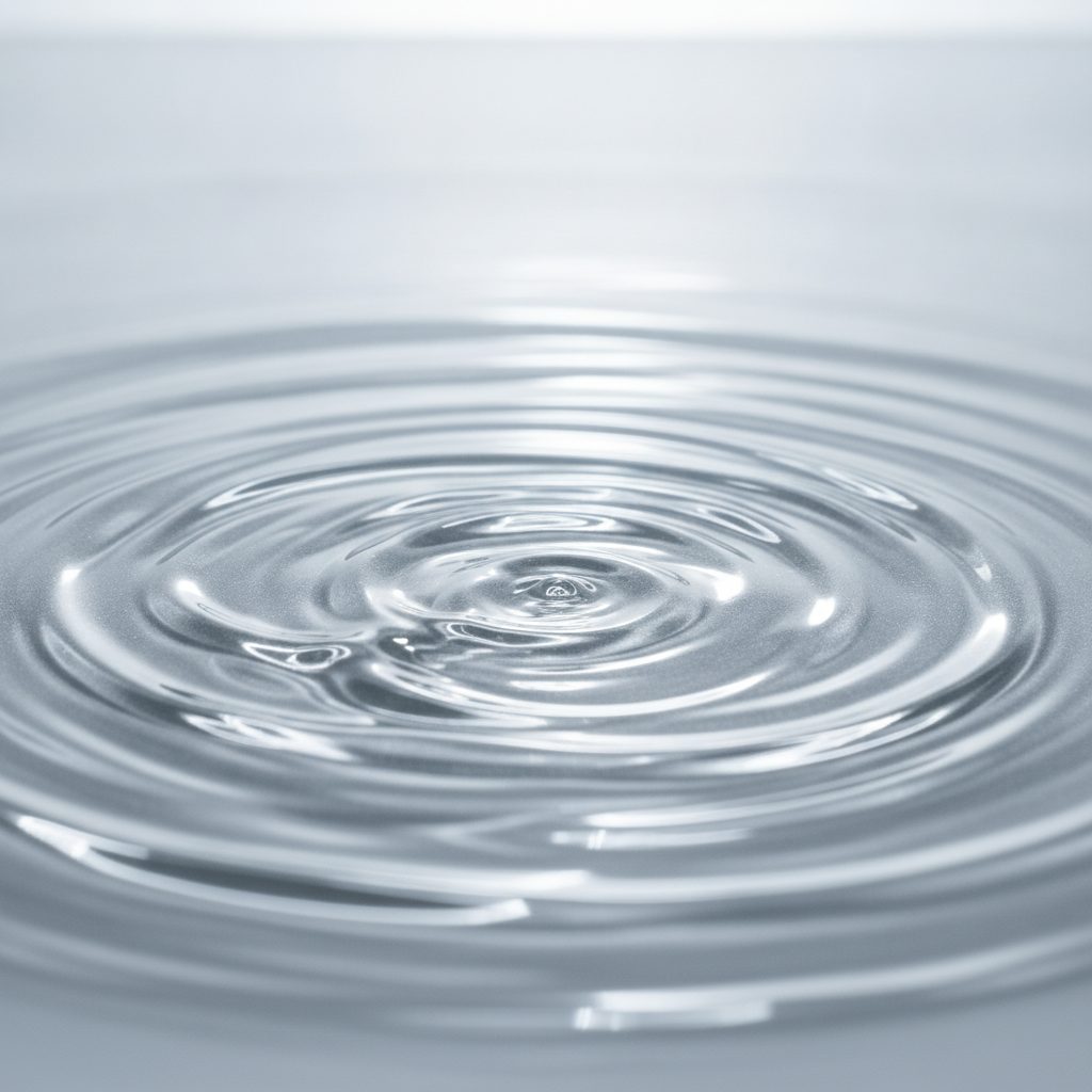 Abstract ripples in a viscous silver hair treatment liquid
